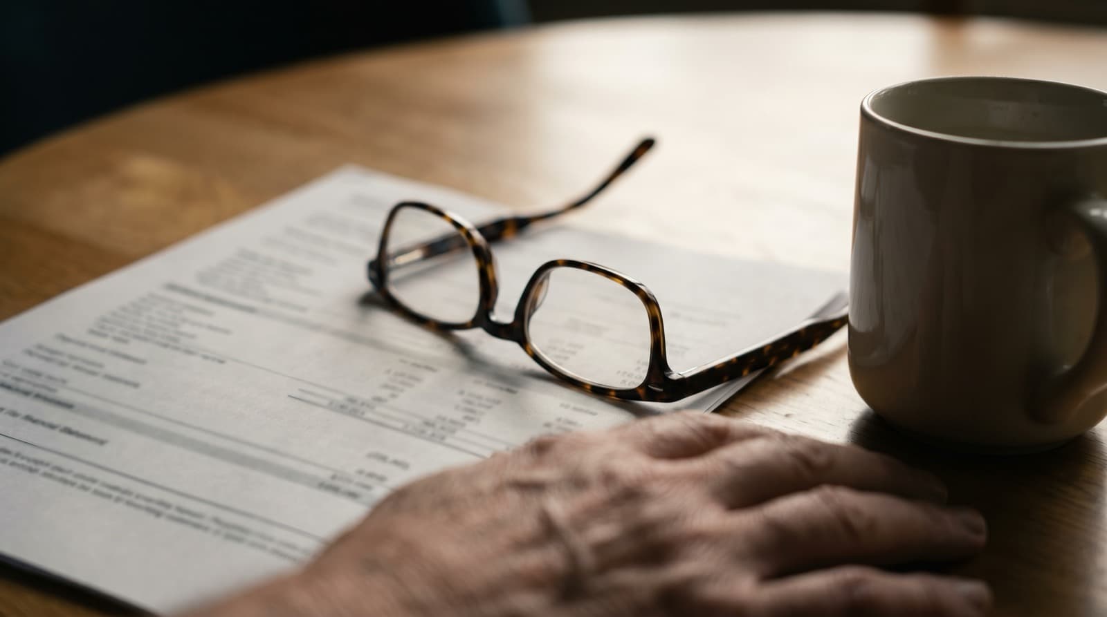 Couple in their late 50s reviewing health insurance options at home